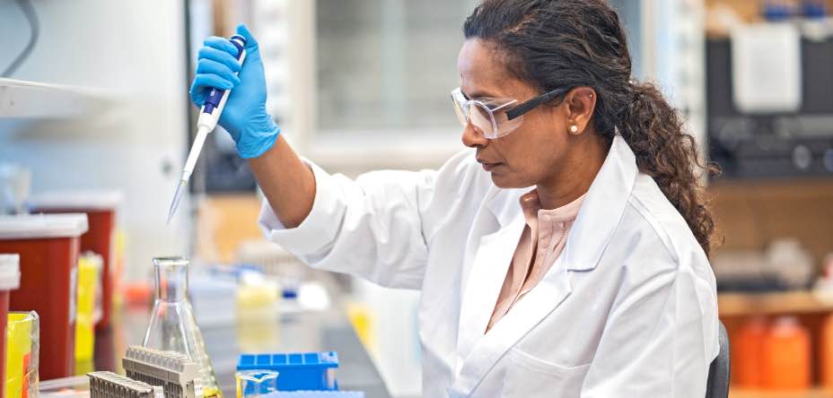 Scientist investigating beaker